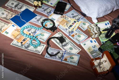 Evidence bag next to dollar banknotes in a crime investigation unit, concept image