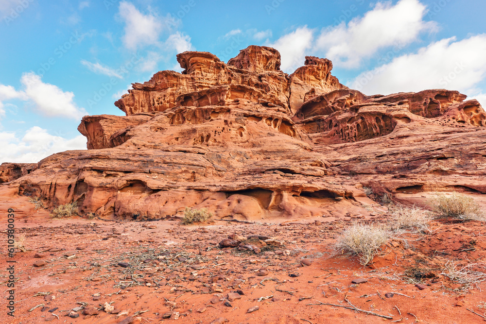 Red orange sandstone rocks formations in Wadi Rum (also known as Valley of the Moon) desert, Jordan Red orange sandstone rocks formations in Wadi Rum (also known as Valley of the Moon) desert, Jordan
