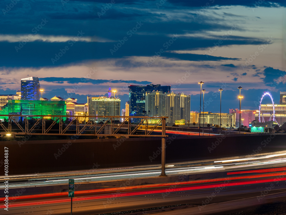 Las Vegas skyline at dusk with local freeway traffic