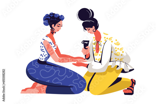 Body painting with henna. Temporary tattoo with herbal paints. Traditional decorative pattern on body. Tattooing process. Mehendi, woman decorates hands and feet with henna