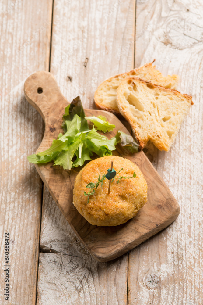 vegetarian hamburger with green salad and sliced bread vegetarian hamburger with green salad and sliced bread