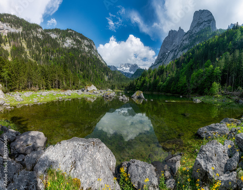 Fototapeta Naklejka Na Ścianę i Meble -  Middle Gosau Lake ( Gosaulacke ) with Dachstein Summit in the background reflecting in water, Salzkammergut, Austria