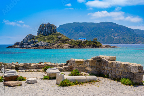 Fototapeta Naklejka Na Ścianę i Meble -  Ruins of the Basilica St. Stefanos in front of beautiful Island Kastri - beautiful coast scenery of Kos, Greece