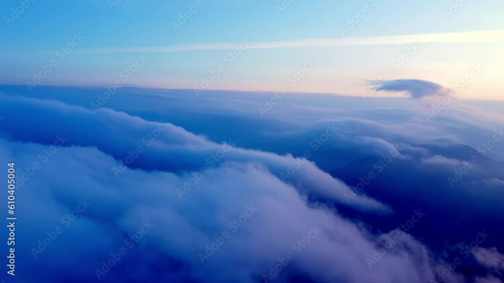 Aerial view of low clouds in the morning at sunrise, clear blue sky Aerial view of low clouds in the morning at sunrise, clear blue sky