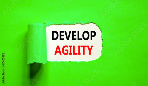 Develop agility symbol. Concept words Develop agility on beautiful white paper on a beautiful green background. Business, support and develop agility concept. Copy space.