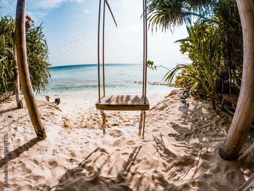 Fototapeta Naklejka Na Ścianę i Meble -  swing on a tropical beach summer fun