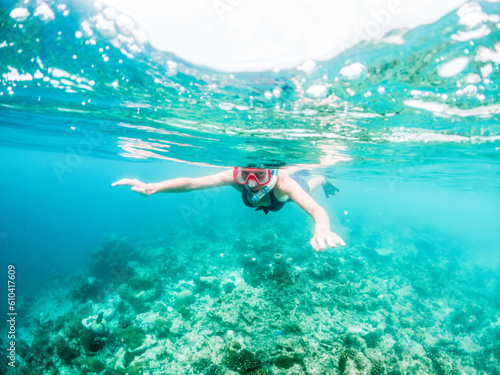 woman snorkeling in clear tropical sea © Melinda Nagy