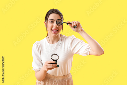 Young woman with magnifiers...