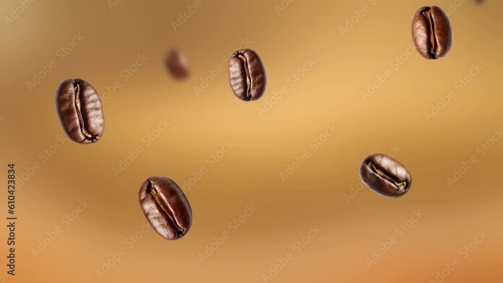 Falling coffee beans on a golden yellow background, roasted arabica beans in slow motion. Falling coffee beans on a golden yellow background, roasted arabica beans in slow motion.