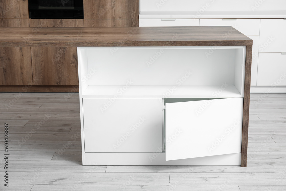 White counter with drawers in light kitchen White counter with drawers in light kitchen