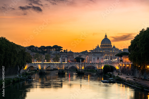 St. Peter's basilica across Tiber River canal at sunset in Rome, Italy © Pawel Pajor