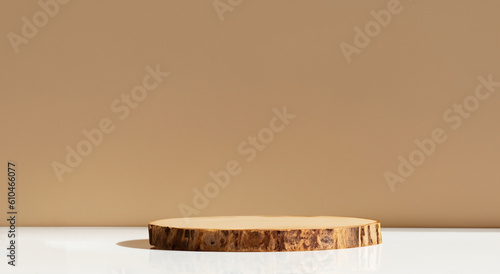 Fototapeta Naklejka Na Ścianę i Meble -  beautiful wooden podium bars with a shadow of a leaf with a white floor