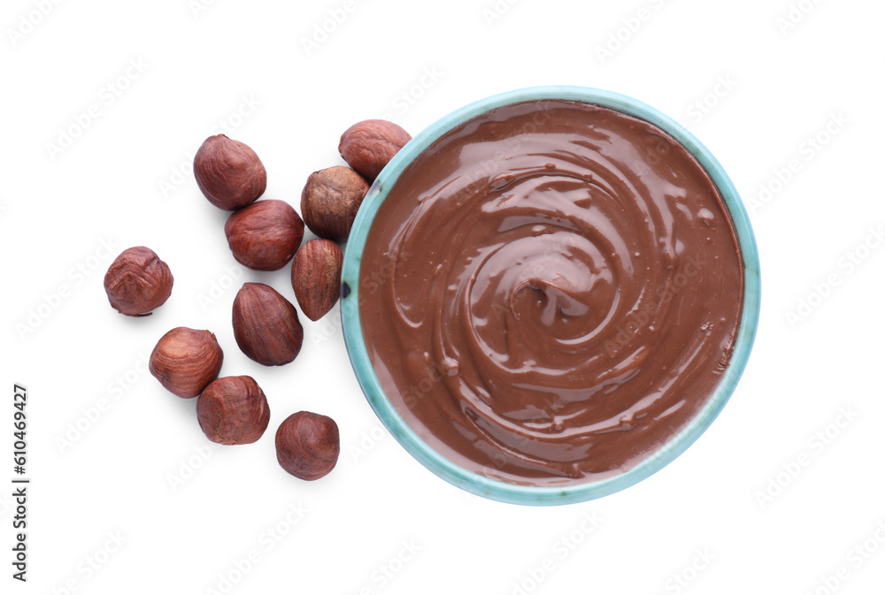 Bowl with delicious chocolate paste and hazelnuts on white background, top view Bowl with delicious chocolate paste and hazelnuts on white background, top view