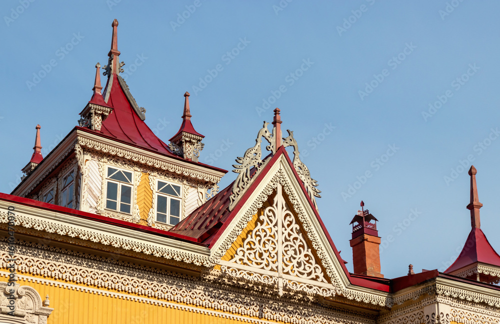 Old house with firebirds in Tomsk, Russian traditional wood carving