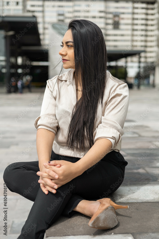 young latin woman with straight hair smiling, wearing a formal blouse, fashion and beauty for office, portrait of entrepreneur