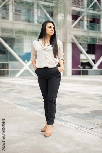 relaxed young woman with black straight hair, entrepreneur with modern lifestyle and beauty, model in business attire, fashion © Alejandro