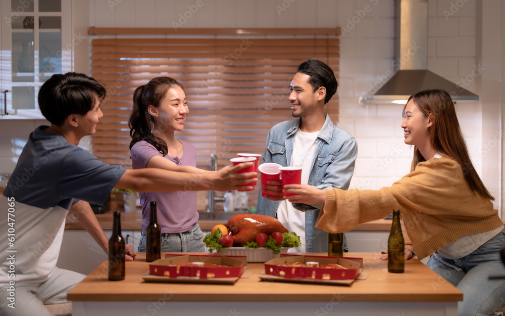 Group of happy Asian friends enjoying dinner together at home. Group of happy Asian friends enjoying dinner together at home.