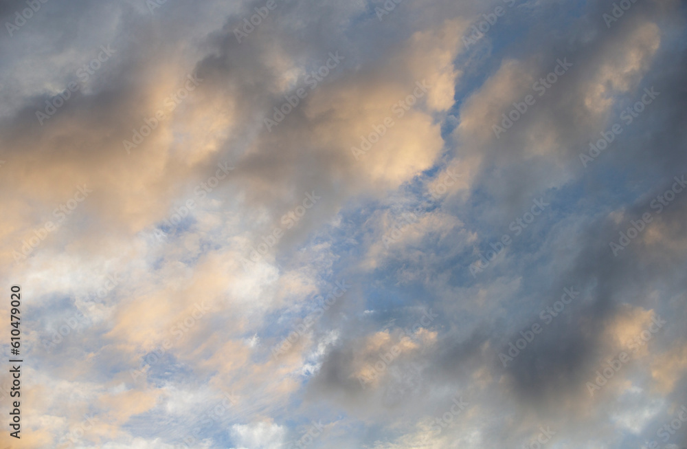 Cloudscape, Colored Clouds at Sunset near the Ocean in a Blue Sky