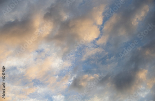 Cloudscape, Colored Clouds at Sunset near the Ocean in a Blue Sky