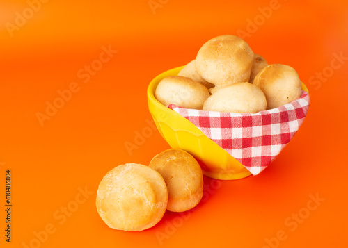 Cheese bread (Brazilian pao de queijo mineiro), front view, focused, isolated, on a bowl photo