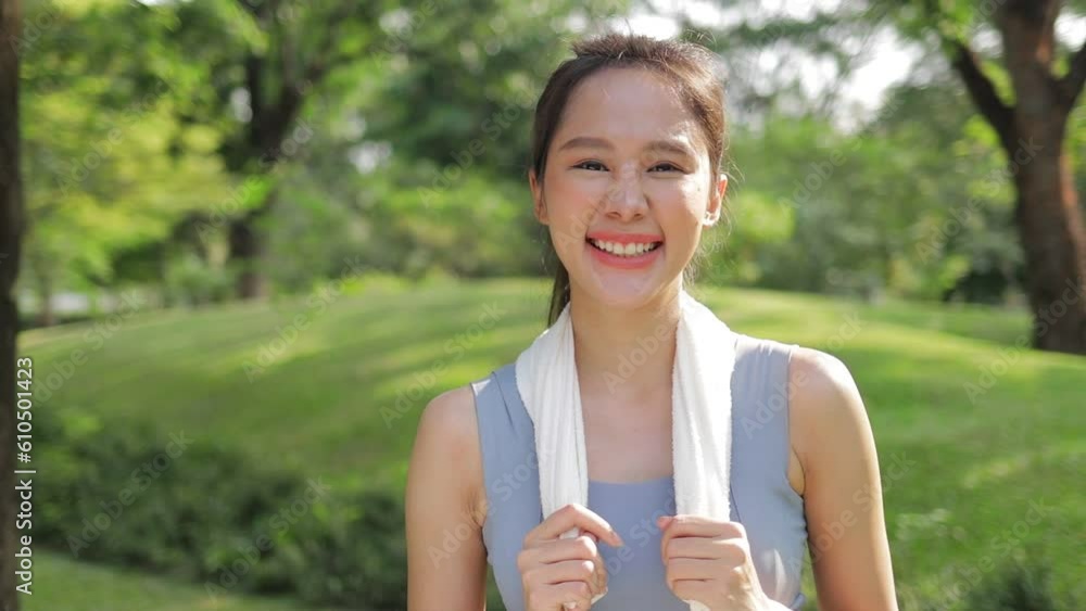 Portrait of young asian woman exercising outdoors in park She smiles bright and happy. Sport concept, health care Portrait of young asian woman exercising outdoors in park She smiles bright and happy. Sport concept, health care