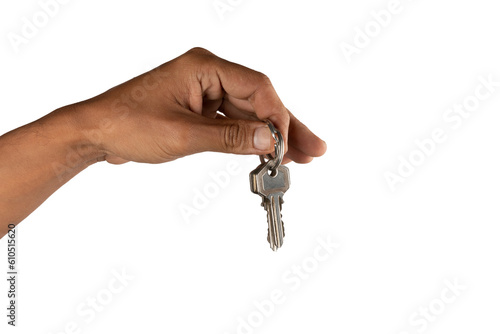Black male hand holding key to house or business isolated