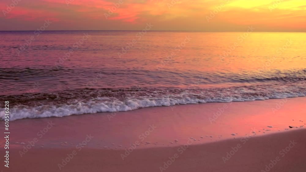 Beautiful sea coast with reflection of pink and gold sunrise light on the colors pink and yellow sky background. Calm shore scene, by the beach with view clouds, slow motion, tilt up, hd.ProRes 422 HQ Beautiful sea coast with reflection of pink and gold sunrise light on the colors pink and yellow sky background. Calm shore scene, by the beach with view clouds, slow motion, tilt up, hd.ProRes 422 HQ