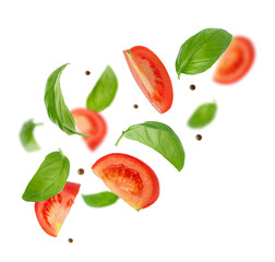 Flying ingredients of tomatoes, basil, pepper on white background. Italian food