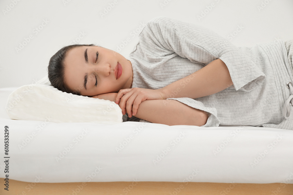 Woman sleeping on memory foam pillow indoors Woman sleeping on memory foam pillow indoors