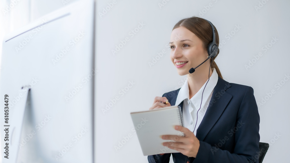 Call center agent woman with headset working on support hotline in modern office. Smiling female customer support phone operator at workplace. Call center agent woman with headset working on support hotline in modern office. Smiling female customer support phone operator at workplace.