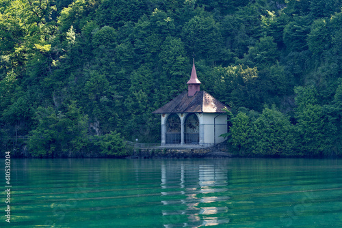 Famous Tell's Chapel at lakeshore of Lake Uri on a sunny spring day. Photo taken May 22nd, 2023, Sisikon, Canton Uri Switzerland. © Michael Derrer Fuchs