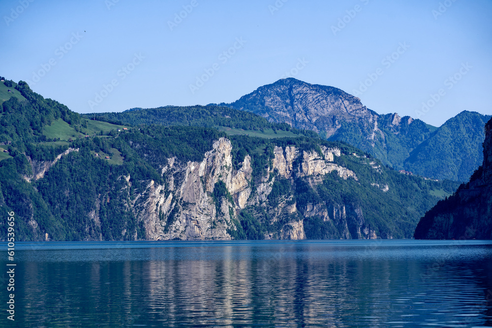 Scenic landscape with Lake Lucerne and mountain panorama in the Swiss Alps on a sunny spring day. Photo taken May 22nd, Sisikon, Canton Uri, Switzerland.