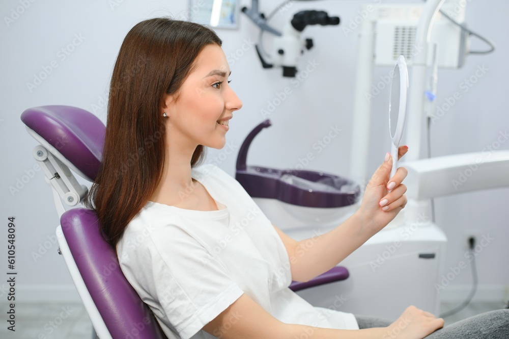 Young smiling woman with beautifiul teeth, having a dental inspection Young smiling woman with beautifiul teeth, having a dental inspection