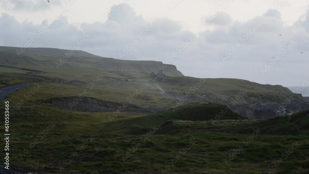 Austere Irish Coast with strong winds blowing sea spray Austere Irish Coast with strong winds blowing sea spray