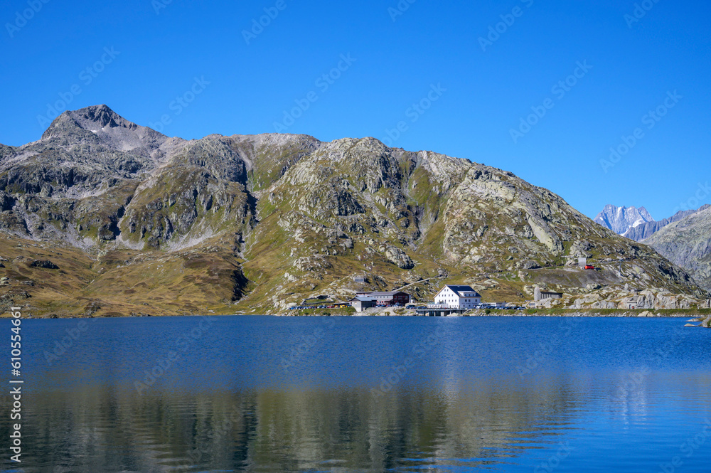 Grimsel lake on the Grimselpass with reflection and blue sky, Grimselpass, Switzerland.