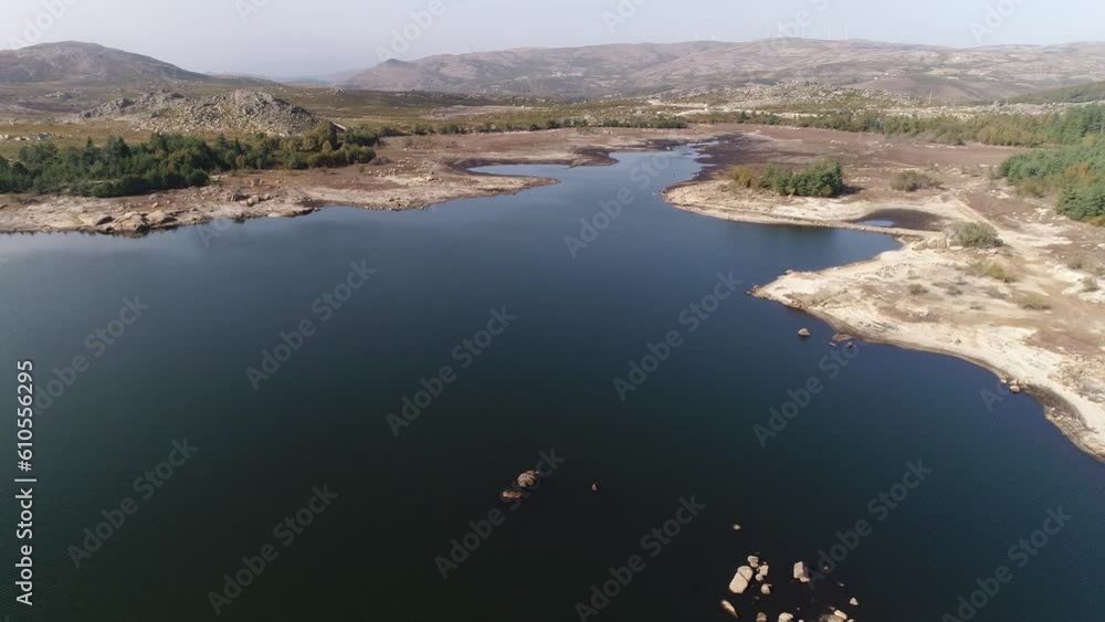 Aerial shot of a reservoir with low water levels Aerial shot of a reservoir with low water levels