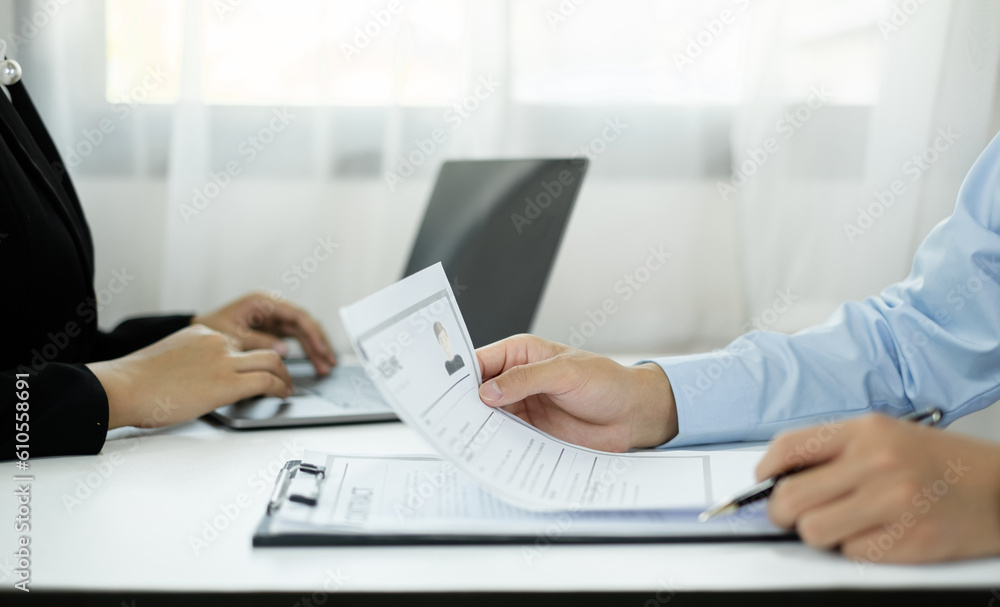 HR Manager talks to job applicants for job interviews about careers and Her personal history in the company. Employment and Recruitment concepts HR Manager talks to job applicants for job interviews about careers and Her personal history in the company. Employment and Recruitment concepts