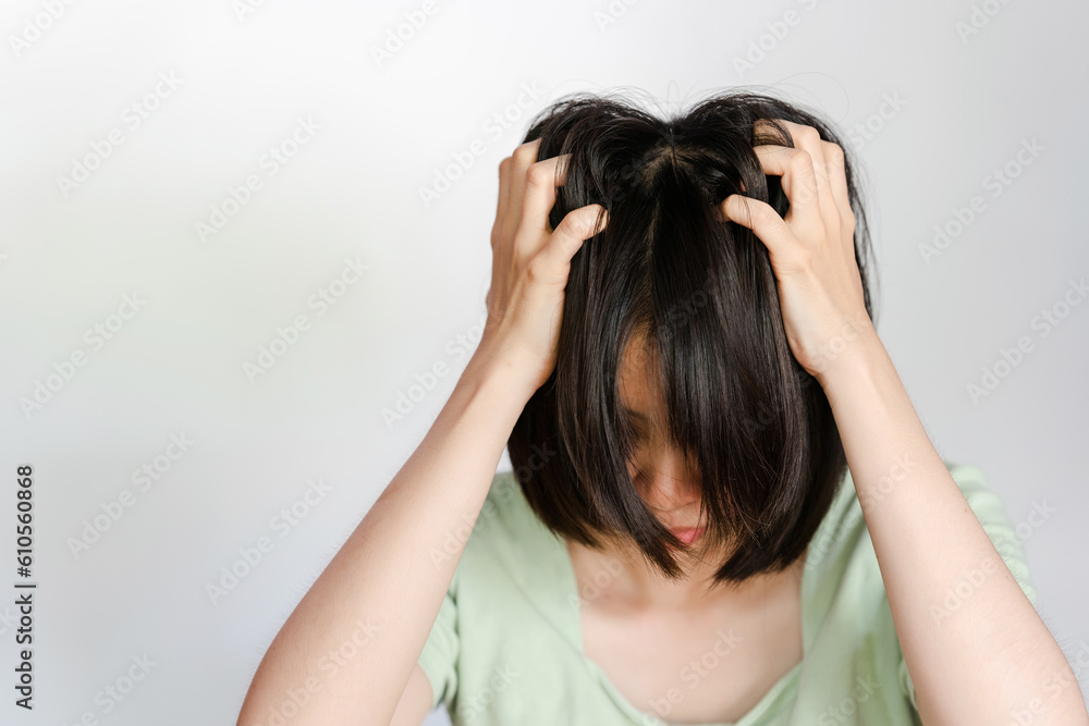 Asian woman itchy head because of dandruff or fungus on scalp on white background. Asian woman itchy head because of dandruff or fungus on scalp on white background.