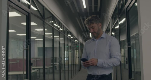 Wallpaper Mural Mature Adult Businessman using Smart phone in Office at night Torontodigital.ca