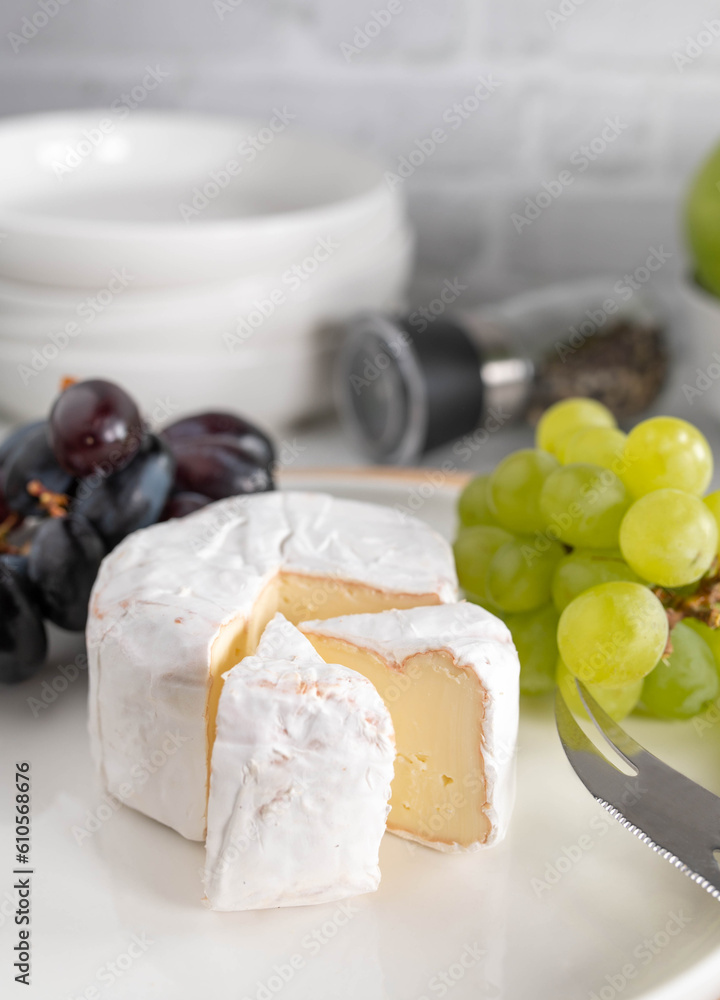 Plate with brie and grapes