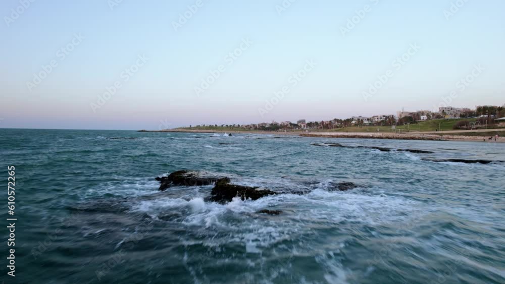 Aerial shot over the sea with rock beach is Bat Yam, Tel Aviv, Israel