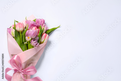 Fototapeta Naklejka Na Ścianę i Meble -  Beautiful bouquet of colorful tulip flowers on white background, top view. Space for text