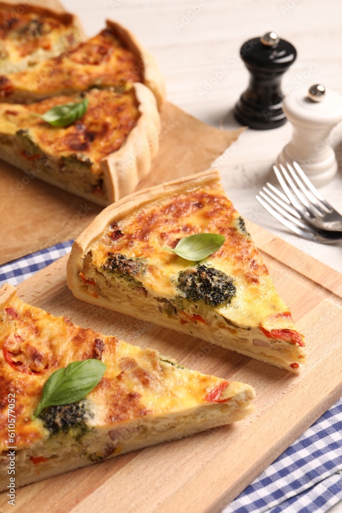 Delicious homemade vegetable quiche on wooden board Delicious homemade vegetable quiche on wooden board
