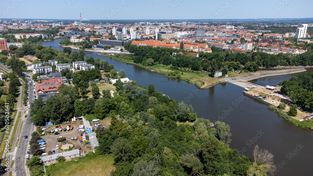 Aerial view, general cityscape of Wroclaw city, Poland. Trees surrounding Odra River.