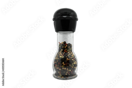 Pepper grinder. A Professional pepper mill of colored peppers mix isolated on a white background. Front view of glass pepper mill isolated on white. photo