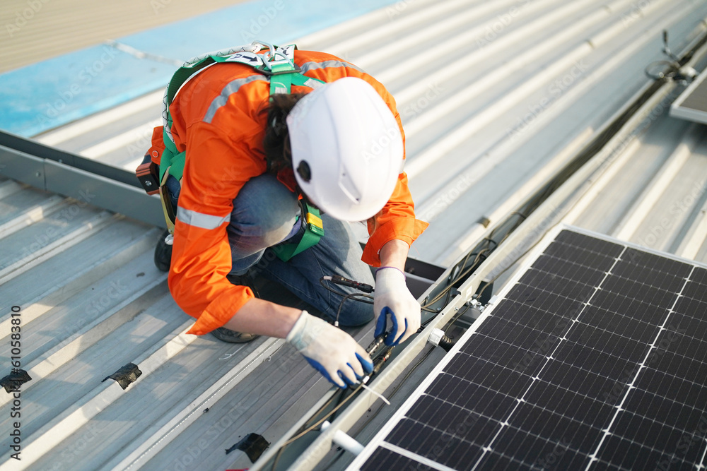 professional technician or engineer installing solar panels, Alternative energy for installed solar panels in use on roof of home professional technician or engineer installing solar panels, Alternative energy for installed solar panels in use on roof of home