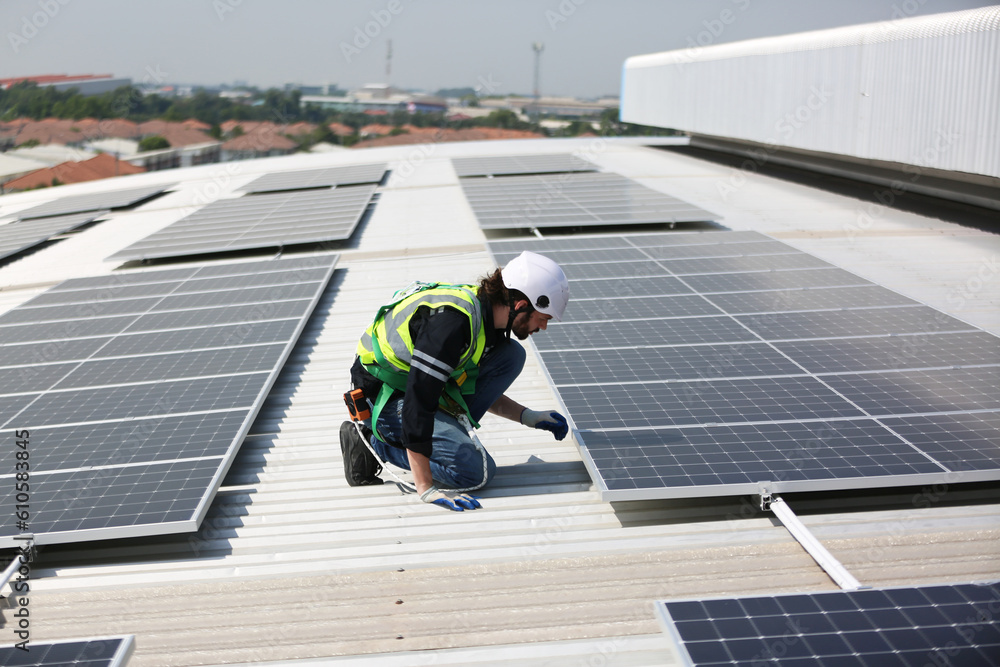 professional technician or engineer installing solar panels, Alternative energy for installed solar panels in use on roof of home professional technician or engineer installing solar panels, Alternative energy for installed solar panels in use on roof of home