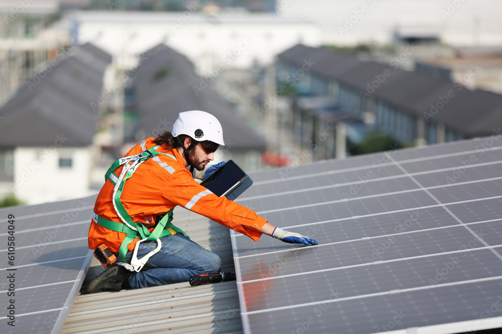 professional technician or engineer installing solar panels, Alternative energy for installed solar panels in use on roof of home professional technician or engineer installing solar panels, Alternative energy for installed solar panels in use on roof of home