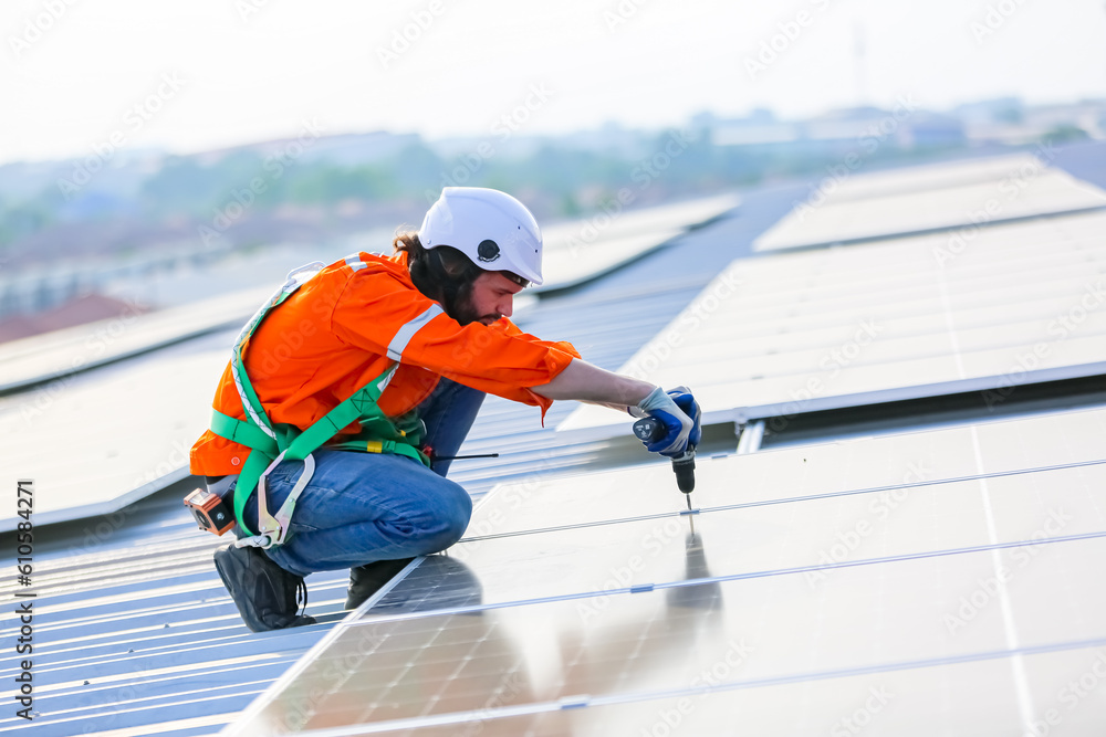 professional technician or engineer installing solar panels, Alternative energy for installed solar panels in use on roof of home professional technician or engineer installing solar panels, Alternative energy for installed solar panels in use on roof of home