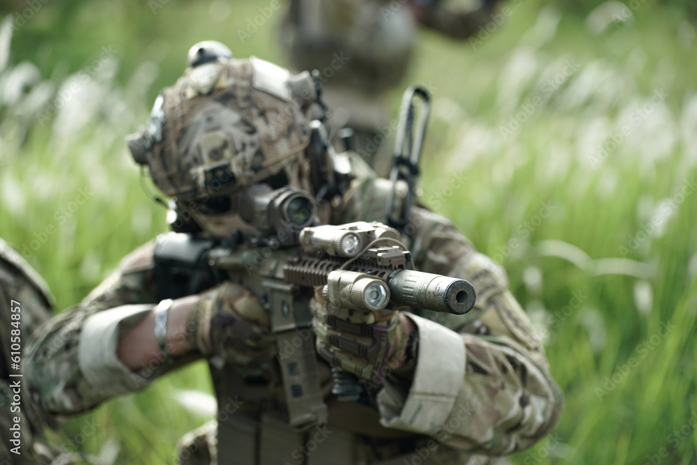 Army elite troops marksman, special operations forces sniper wearing mask and glasses, night-vision or infrared thermal imaging device on helmet, holding service rifle with optical sight and silencer Army elite troops marksman, special operations forces sniper wearing mask and glasses, night-vision or infrared thermal imaging device on helmet, holding service rifle with optical sight and silencer